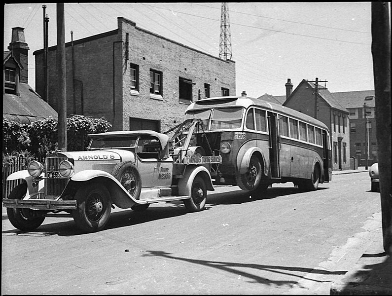 File:1929 Cadillac tow truck with bus Sydney AUSTRALIA December 1938.jpg