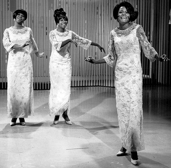 Wilson (middle) performing with the Supremes