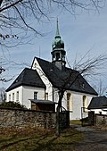 Church with churchyard and enclosure, bell house and memorial for those who died in the First World War