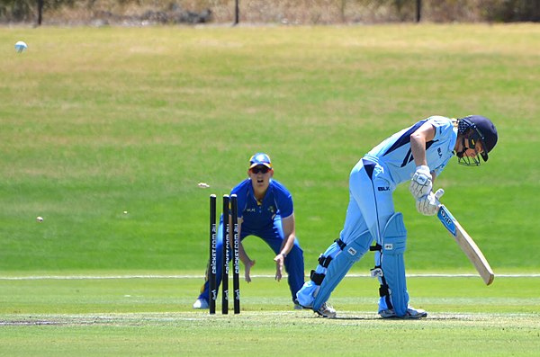 NSW Breakers' Nicola Carey is bowled by ACT Meteors' Marizanne Kapp (not pictured). Note the ball, and the flying bails, one of which has broken into 