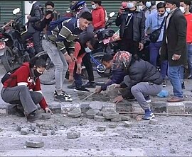 CPN (Maoist Centre) sister organisation, YCL and ANNISU (Revolutionary) leaders destroying public properties to attack police force ANNISU (Revolutionary).jpg