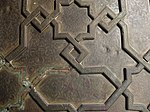 Detail of the bronze plating on the doors of the madrasa's entrance