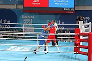 Deutsch: Boxen bei den Olympischen Jugendspielen 2018 Tag 12, 18. Oktober 2018 - Kampf um Bronze im Leichten Weltergewicht Jungen – Hassan Azim (Großbritannien, rot) schlägt Mohammed Boulaouja (Marokko, blau) RSC; Ringrichter ist Wulfren Olivares Peréz (Kolumbien). English: Boxing at the 2018 Summer Youth Olympics on 18 October 2018 – Bronze Medail Match Light Welterweight Boys - Hassan Azim (Great Britain, red) beats Mohammed Boulaouja (Morocco, blue) RSC; Referee is Wulfren Olivares Peréz (Columbia). Español: Boxeo en los Juegos Olímpicos Juveniles de Verano de 2018 en 18 de octubre de 2018 - Medalla de bronce de los hombres ligeros de peso welter: Hassan Azim (Gran Bretaña, rojo) vence a Mohammed Boulaouja (Marruecos, azul) RSC; El árbitro es Wulfren Olivares Peréz (Colombia).