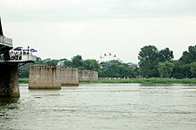 North Korean Ferris wheel with Broken Bridge in foreground (2008)