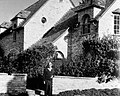 Ernest Bixler standing next to Scenic Drive house