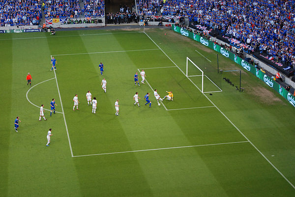 The penalty area is the large marked rectangular area. The smaller rectangle within it is the goal area (here, the yellow-shirted goalkeeper is the on