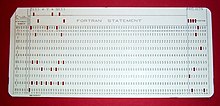 A 1970s punched card containing one line from a Fortran program. The card reads: "Z(1) = Y + W(1)" and is labeled "PROJ039" for identification purposes. FortranCardPROJ039.agr.jpg