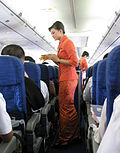 Thumbnail for File:Garuda Indonesia Flight Attendants Serving Refreshment.jpg