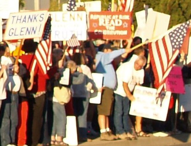In Beck's hometown of Mt. Vernon, Washington, supporters and detractors hold handmade signs on the day Beck was honored by the mayor.