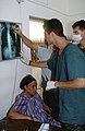 Greek army medics examine X-ray, Somalia 1993.jpg