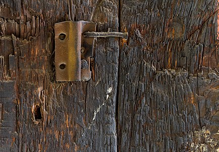 Forgotten clamp at a post in the tool shed of the Quarzwerke in Sythen, Haltern, North Rhine-Westphalia, Germany