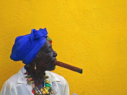 A woman smoking a cigar in Old Havana