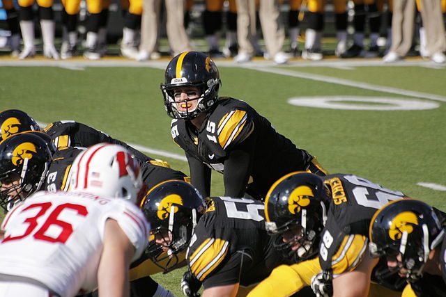 The football team of the University of Iowa (the Hawkeyes) play their rival, the University of Wisconsin–Madison Badgers, at Kinnick Stadium in Novemb