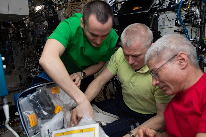 File:ISS-65 Flight Engineers review medical hardware.jpg