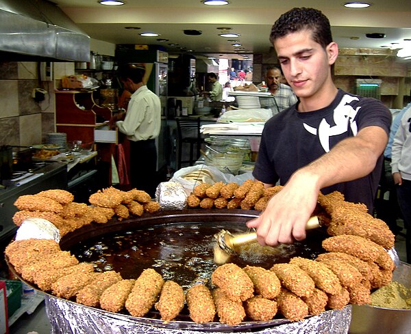 Falafel being fried in a scoop, Ramallah