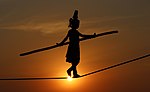 Thumbnail for File:Indian tightrope girl performing folk art Baunsa Rani (Crop 2).jpg