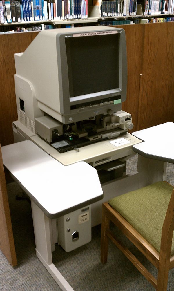 A microfiche reader in a library