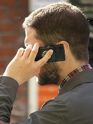A man speaking on a mobile telephone