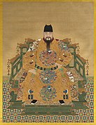 Ming Emperor wearing round-collar robes decorated with dragon roundels. This form of dress is called the longpao (i.e., the dragon robes).