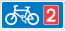 Panneau de signalisation rectangulaire, bleu avec un symbole de vélo blanc et un carré rouge avec le numéro 2.