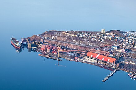 The harbour in Narvik, Norway where a ship is loaded with iron ore.