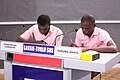 Two students at the NSMQ working hard to make Lassec proud