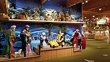 Tableau at the west entrance (June 2019) Nativity scene and displays at Bronner's Christmas Wonderland.jpg