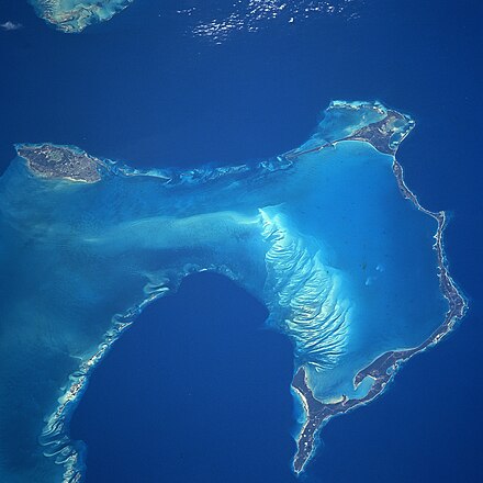 NASA satellite image, showing New Providence Island to the west, and east of it, the long, narrow island of Eleuthera running north and south (along with its associated Harbour and other small islands), as seen from space in 1997.
