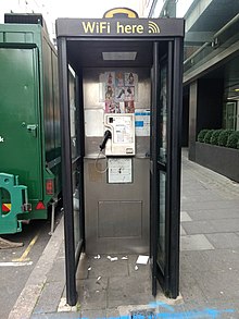 Phone box with tart cards, London, 2017. Phone box with tart cards 02.jpg