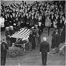 Photograph of servicemen removing the flag from the casket of President John F. Kennedy at Arlington National... - NARA - 200452.jpg