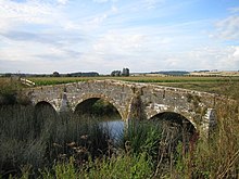 Pill Bridge, on the River Yeo, 2.3 km west of the town of Ilchester in Somerset, a narrow and ancient pack-horse bridge, the repair and maintenance of which in 1530 was the responsibility of the tenants of Brooke, Ilchester Pill Bridge - geograph.org.uk - 214869.jpg