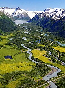 An image of a creek between two mountains