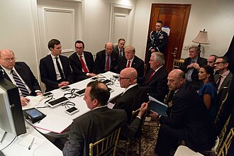 When Donald Trump became president in 2017, a SCIF was set up at his Mar-a-Lago resort in Florida, which he refers to as his Winter White House. Trump (at the head of the table with various cabinet members, advisers, and staffers) is seen here monitoring the Syrian cruise missile attack from the Mar-a-Lago SCIF. President Donald Trump receives a briefing on a military strike.jpg