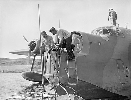 A mooring compartment was situated in the nose of the Sunderland, containing anchor, winch, boat-hook and ladder. The front turret was designed to slide back, enabling the crew to secure the aircraft to a buoy, as demonstrated here.