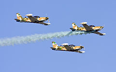 A formation of three T-260 training aircraft of the 1. Skwadra in flight