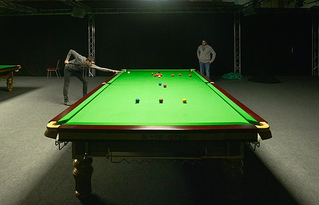 Four-time world champion Mark Selby playing at a practice table during the 2012 Masters tournament