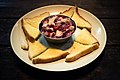 A plate of traditional Kadazan swordfish hinava served with sandwich breads as an appetizer.