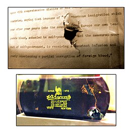 The bullet-damaged speech and eyeglass case on display at the Theodore Roosevelt Birthplace in Manhattan, New York City TR Assissination Bullet Damage.jpg
