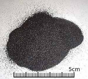A small heap of uniform black grains smaller than 1mm diameter.