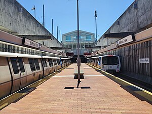 Two trains at Balboa Park station, July 2023.jpg