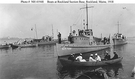 USS Orca (SP-726) exercising at Rockland Section Base, Rockland, Maine, in 1918 with patrol vessels USS Content (SP-538) (left center background) and USS Kangaroo (SP-1284) (astern of Orca) and various small boats. USS Orca (SP-726) exercising.jpg