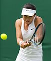 Zhu Lin competing in the first round of the 2015 Wimbledon Championships.
