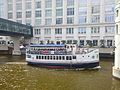 Riverboat passing the former Milwaukee flagship location