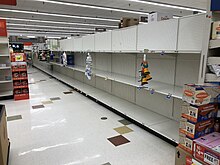 Bare shelves due to panic buying at the Giant supermarket in Franklin Farm, Virginia in March 2020 2020-03-13 22 34 45 Bare shelves due to panic buying in the Giant supermarket at the Franklin Farm Village Shopping Center in the Franklin Farm section of Oak Hill, Fairfax County, Virginia during the COVID-19 corona virus pandemic.jpg