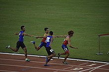 Filipino athletes (in blue) competing at the 4 x 400 m relay event 4x400 m relay Thailand and Philippines 2015 SEA Games.jpg