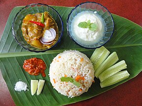 Pulao Mangsho, with condiments and yogurt, West Bengal, India