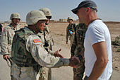 Brigadier General Albert Bryant Jr. (left) meets with Willis (right) in Iraq (2003) ActorBruceWillis Iraq.jpg