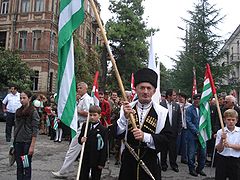 Parade exhibiting Abkhazian flags