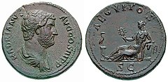 Hadrian coin celebrating Aegyptus Province, struck c. 135. In the obverse, Egypt is personified as a reclining woman holding the sistrum of Hathor. Her left elbow rests on a basket of grain, while an ibis stands on the column at her feet.