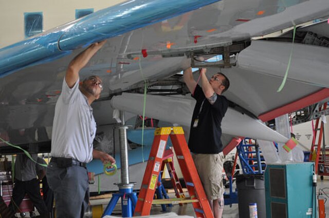 Mechanics working at Bombardier maintenance facility near Dallas, Texas
